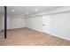 Finished basement with modern floors, neutral walls, recessed lighting, and white doors at 2131 Glendale Dr, Decatur, GA 30032