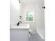 Bathroom boasts white subway tile, a modern vanity, and black hardware for a sleek design at 2131 Glendale Dr, Decatur, GA 30032