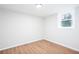 Neutral bedroom showcases modern flooring, white trim, and a window for natural light at 2131 Glendale Dr, Decatur, GA 30032