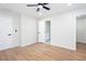 A bright bedroom featuring a ceiling fan, hardwood floors and ensuite bathroom access at 2131 Glendale Dr, Decatur, GA 30032