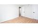 Neutral bedroom with modern flooring, white trim, and a doorway to another room at 2131 Glendale Dr, Decatur, GA 30032