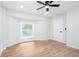 Bedroom features a large bay window providing abundant natural light, and wood flooring at 2131 Glendale Dr, Decatur, GA 30032