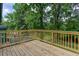 Exterior wooden deck and backyard enveloped in greenery at 2131 Glendale Dr, Decatur, GA 30032
