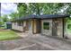 View of a charming single-story home with light brick facade and a concrete driveway at 2131 Glendale Dr, Decatur, GA 30032