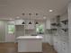 Bright, remodeled kitchen features an island, stainless steel appliances, and white cabinetry at 2131 Glendale Dr, Decatur, GA 30032