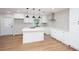 Bright, renovated kitchen featuring an island, white cabinets and modern stainless steel appliances at 2131 Glendale Dr, Decatur, GA 30032