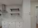 The kitchen is decorated with open shelves and stone countertops at 2131 Glendale Dr, Decatur, GA 30032