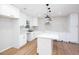 Bright, renovated kitchen featuring an island, white cabinets and modern stainless steel appliances at 2131 Glendale Dr, Decatur, GA 30032