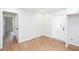 Neutral room featuring light-colored walls, a door to the backyard and light hardwood floors at 2131 Glendale Dr, Decatur, GA 30032
