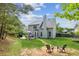 Backyard view with a fire pit and outdoor seating area at 2173 Beacon Crest Dr, Buford, GA 30519