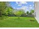 Backyard featuring lush green grass and a small tree at 2173 Beacon Crest Dr, Buford, GA 30519