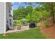 Backyard with a wooden deck featuring a grill and patio furniture at 2173 Beacon Crest Dr, Buford, GA 30519