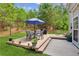 A charming outdoor living space featuring a wooden deck and patio seating area, ideal for relaxation at 2173 Beacon Crest Dr, Buford, GA 30519