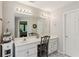 Bright bathroom featuring double sinks, vanity area, and a well-lit mirror at 2173 Beacon Crest Dr, Buford, GA 30519