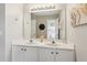 Bright bathroom featuring double sinks, vanity area, and a well-lit mirror at 2173 Beacon Crest Dr, Buford, GA 30519