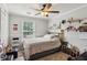 Bright bedroom with a single bed, window, shelves, and personal touches at 2173 Beacon Crest Dr, Buford, GA 30519