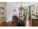 Inviting dining room with hardwood floors, wainscoting, chandelier, and natural light at 2173 Beacon Crest Dr, Buford, GA 30519