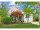 Charming two-story home boasts lush landscaping, an attached two-car garage, and mature trees at 2173 Beacon Crest Dr, Buford, GA 30519