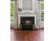 Close up of fireplace featuring hardwood flooring, white mantel, and traditional hearth at 2173 Beacon Crest Dr, Buford, GA 30519