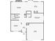 Detailed first-floor plan showcasing the layout of the living room, kitchen, and garage, including measurements at 2173 Beacon Crest Dr, Buford, GA 30519