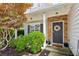 A charming front door with stone accents, a decorative wreath, and mature landscaping at 2173 Beacon Crest Dr, Buford, GA 30519