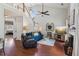 Bright living area with fireplace, large windows, and hardwood floors at 2173 Beacon Crest Dr, Buford, GA 30519