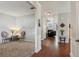 Open floor plan showcasing a living area with hardwood floors and a glimpse into a carpeted living room at 2173 Beacon Crest Dr, Buford, GA 30519