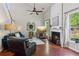 Well-lit living room boasting a fireplace, high ceilings, and abundant natural light at 2173 Beacon Crest Dr, Buford, GA 30519
