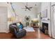 Spacious living room with vaulted ceiling, fan, fireplace, and hardwood floors at 2173 Beacon Crest Dr, Buford, GA 30519