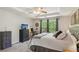 Comfortable main bedroom with tray ceilings, large windows, and ample natural light at 2173 Beacon Crest Dr, Buford, GA 30519