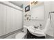 Well-maintained bathroom featuring a shower, a toilet, and a sink, with a clean aesthetic design at 220 Sisson Ne Ave, Atlanta, GA 30317
