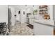Updated kitchen with stainless appliances, bright white cabinets, and modern backsplash and flooring at 220 Sisson Ne Ave, Atlanta, GA 30317