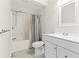 Well-lit bathroom with a tub-shower, sleek vanity, and modern fixtures at 230 Leaf Court, Alpharetta, GA 30005