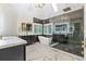 This bathroom features a freestanding tub, a glass shower, and white marble floors at 230 Leaf Court, Alpharetta, GA 30005