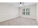 Neutral bedroom with carpet, ceiling fan, and window with shutter blinds at 230 Leaf Court, Alpharetta, GA 30005