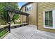 Well-maintained outdoor deck featuring comfortable seating, neutral tones, and backyard views at 230 Leaf Court, Alpharetta, GA 30005