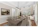 Formal dining room showcases crown molding, large windows, and an elegant chandelier at 230 Leaf Court, Alpharetta, GA 30005