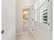 Hallway view leading to a bathroom with modern fixtures at 230 Leaf Court, Alpharetta, GA 30005