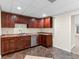 Well-appointed kitchen with modern appliances, rich wood cabinetry, and stylish countertops at 230 Leaf Court, Alpharetta, GA 30005