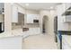 Bright and airy kitchen with stainless steel appliances, white cabinets, and a modern sink at 230 Leaf Court, Alpharetta, GA 30005