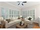 This open living room offers bright natural light from the large windows, and plenty of seating at 230 Leaf Court, Alpharetta, GA 30005