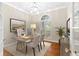 This bright office features a large desk, two chairs, and beautiful natural light from the arched window at 230 Leaf Court, Alpharetta, GA 30005