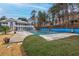Seasonal view of the community swimming pool with cover at 230 Leaf Court, Alpharetta, GA 30005