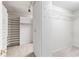 Spacious walk-in closet with multiple storage options and carpet flooring at 230 Leaf Court, Alpharetta, GA 30005
