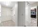 A well-organized walk-in closet with built-in shelving and access to the Primary bathroom at 230 Leaf Court, Alpharetta, GA 30005