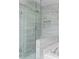 Modern bathroom featuring glass enclosed shower with neutral marble tile at 4910 Longcourt Se Trce # 13, Atlanta, GA 30339