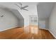 A spacious bedroom with hardwood floors and a ceiling fan at 4910 Longcourt Se Trce # 13, Atlanta, GA 30339