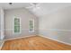 Bright bedroom with hardwood floors, vaulted ceiling, and many windows at 4910 Longcourt Se Trce # 13, Atlanta, GA 30339