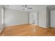 Large bedroom featuring hardwood floors and entry to on-suite bathroom at 4910 Longcourt Se Trce # 13, Atlanta, GA 30339