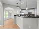 Open kitchen view into dining room, featuring stainless steel appliances and sleek counter tops at 4910 Longcourt Se Trce # 13, Atlanta, GA 30339